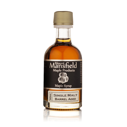 Single-malt barrel-aged maple syrup bottle with tan cap and Mount Mansfield label