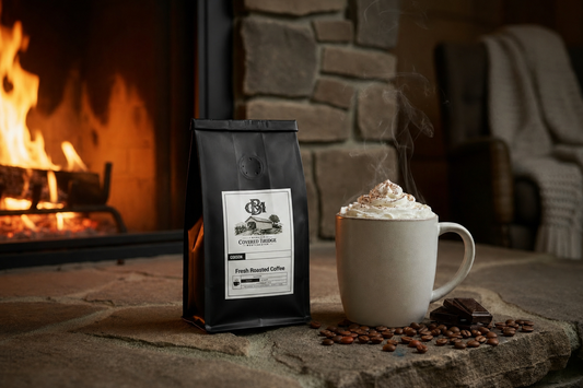 Roasted coffee bag with paper label, beside a mocha cup with whipped cream