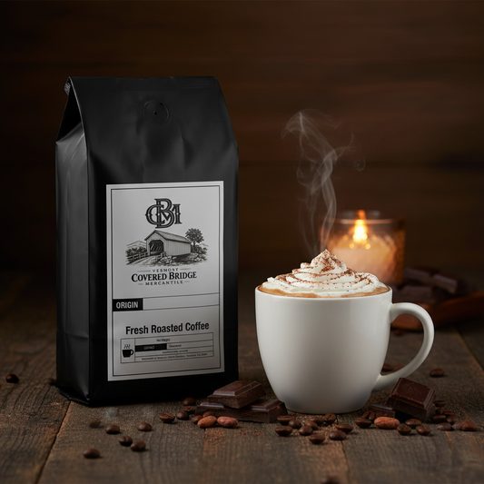 Coffee bag with cup of coffee and scattered beans on tabletop