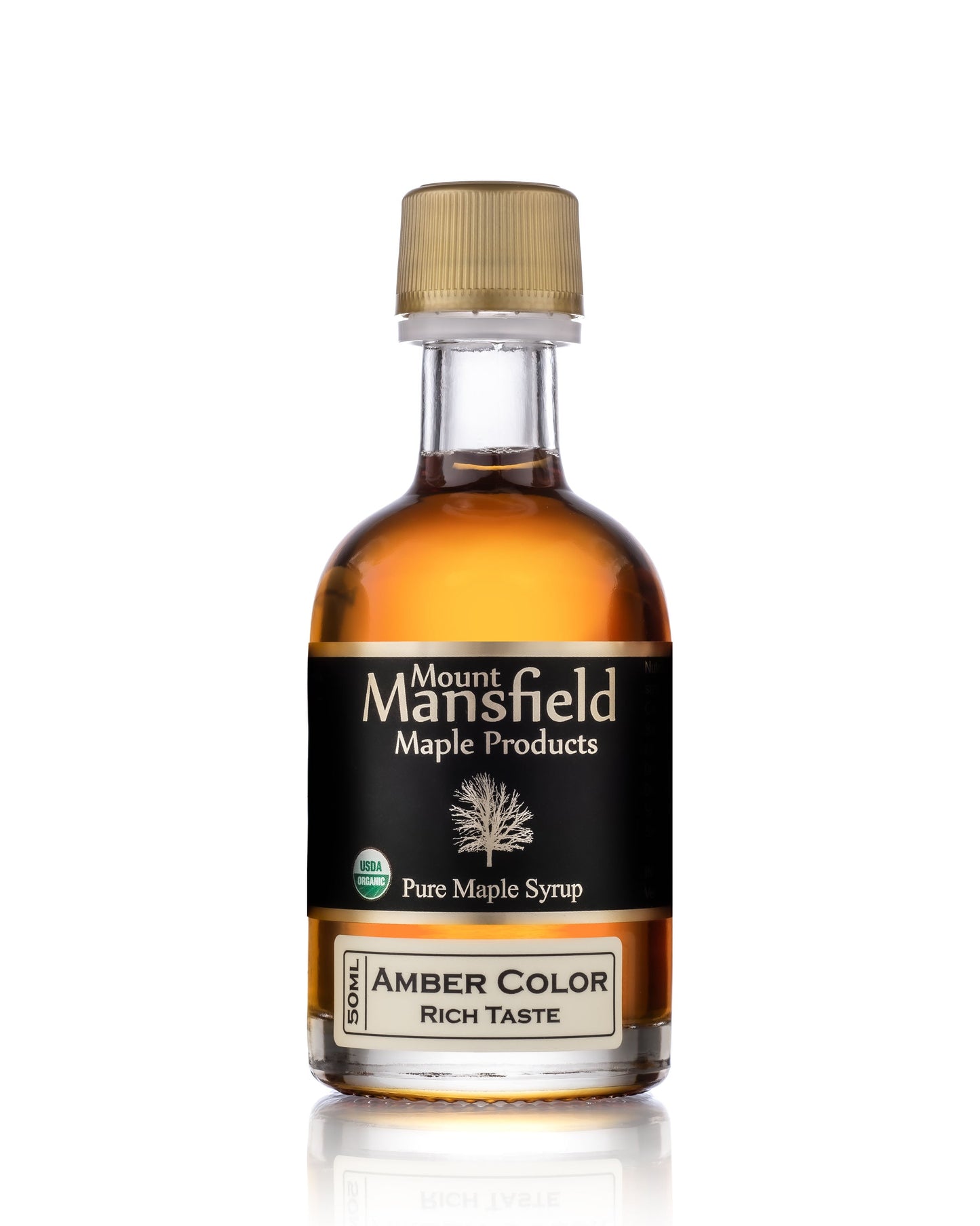 Amber color maple syrup bottle with gold cap, 'Rich Taste' label