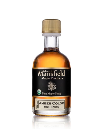 Amber color maple syrup bottle with gold cap, 'Rich Taste' label