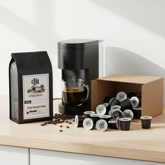 Single-serve coffee capsule pack with black bag, box, and coffee maker