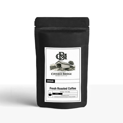 Black roasted coffee bag with front label and sealed top