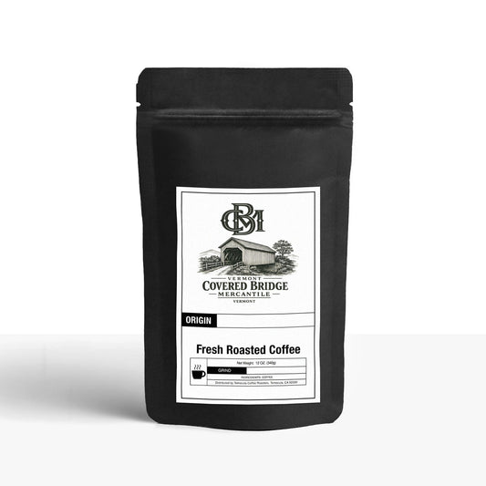 Coffee capsule pack in black pouch with label and fresh roasted coffee details