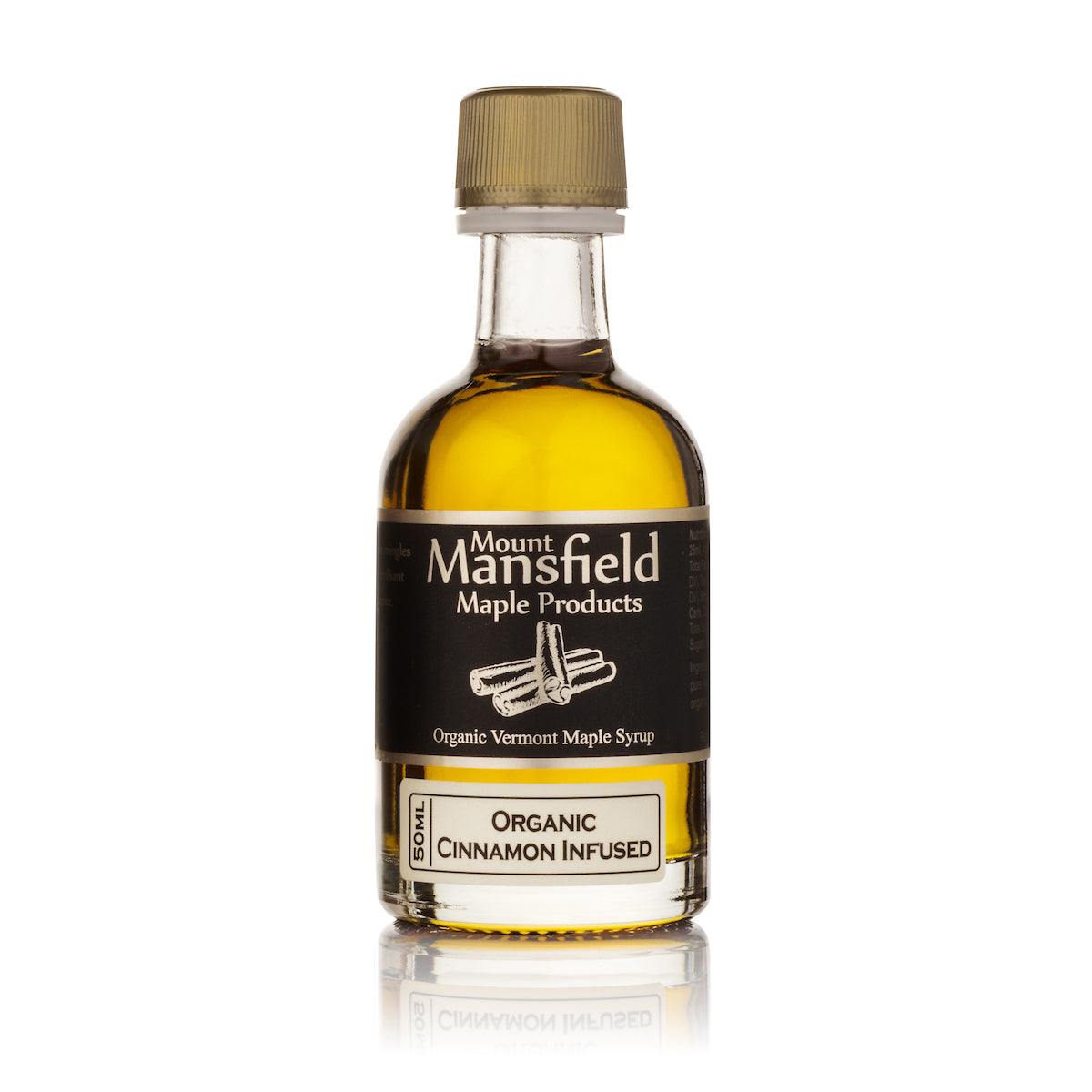 Mount Mansfield organic cinnamon-infused maple syrup bottle with gold cap and amber label.