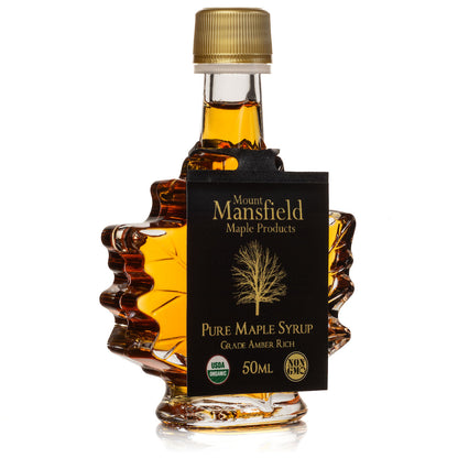 Maple leaf amber syrup bottle with gold cap and black Mount Mansfield label, 50 mL