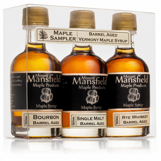 3-pack barrel-aged maple syrup sampler set with three amber glass bottles
