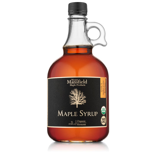 Organic Vermont maple syrup glass bottle, amber syrup and black cap with side handle