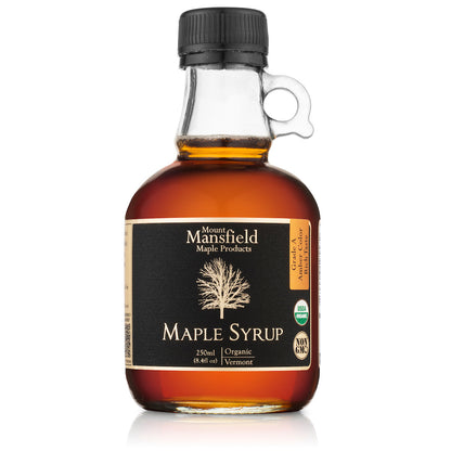 Organic Vermont maple syrup glass bottle with black cap, amber syrup and label