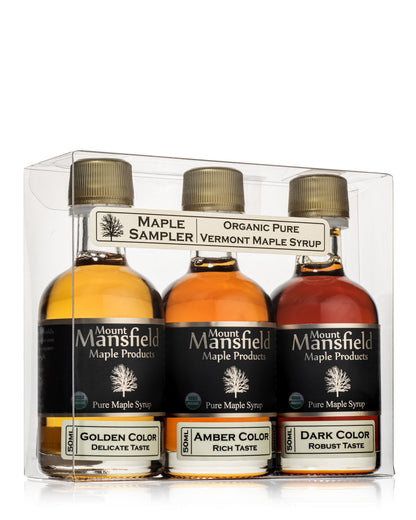 Maple syrup grade sampler set with three bottles: golden, amber, and dark colors